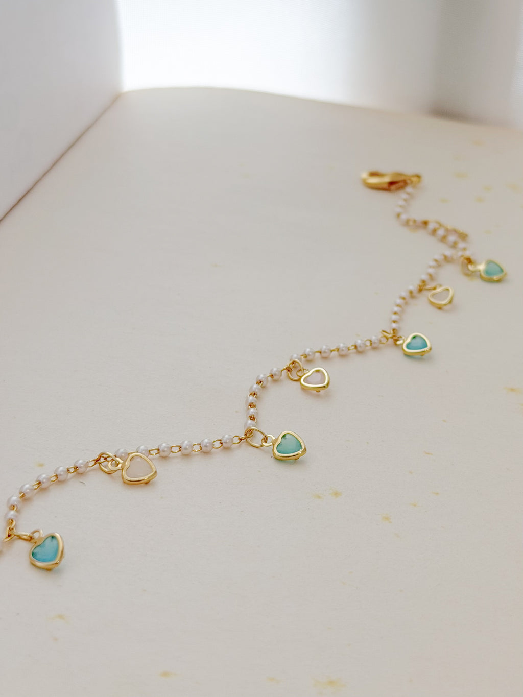 Tobillera Rodio Perlas Corazones Dorado